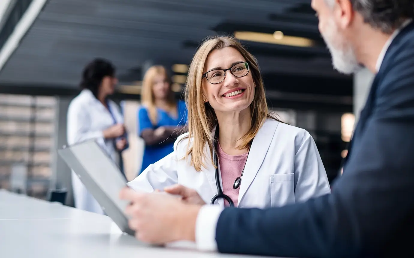 female doctor talking to a patient, value based care