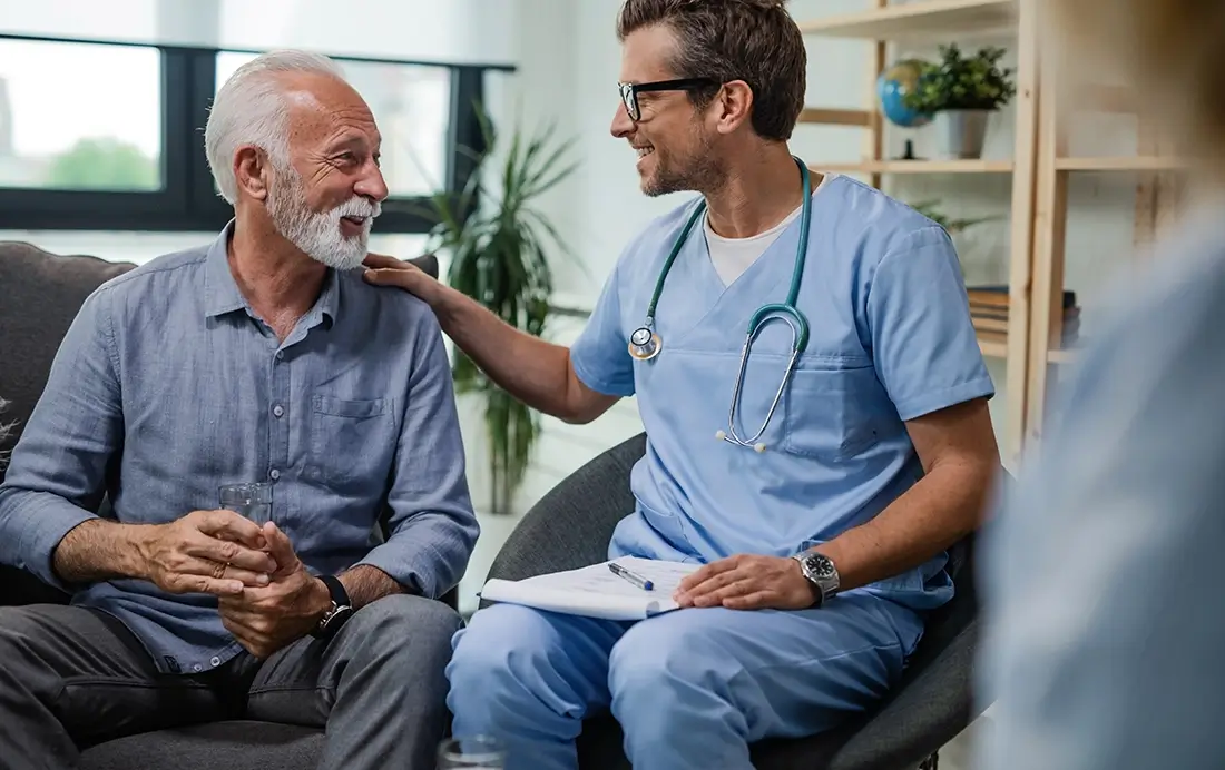 nurse helping an elderly patient